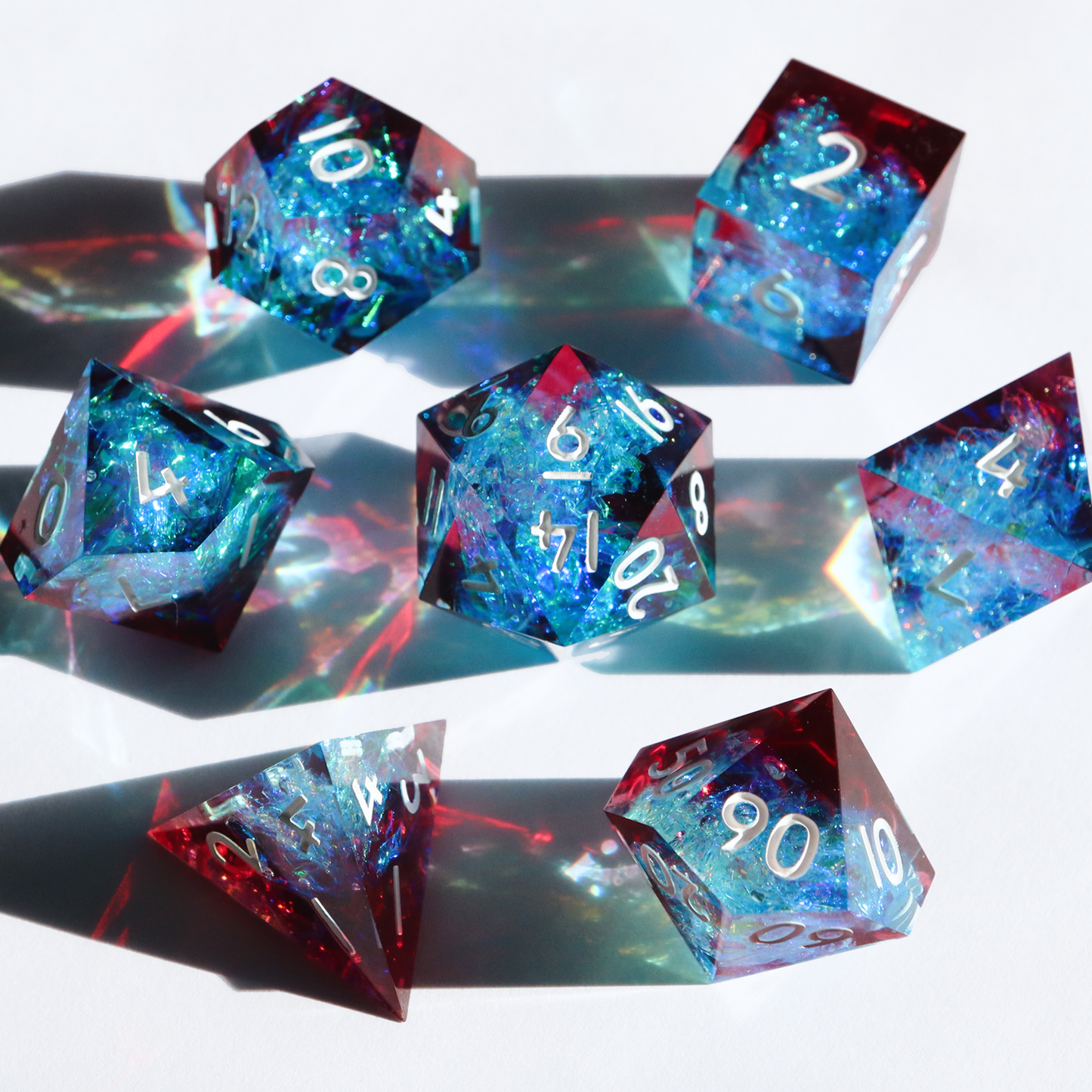 Bleeding Sapphires - handmade sharp edge 7 piece dice set
